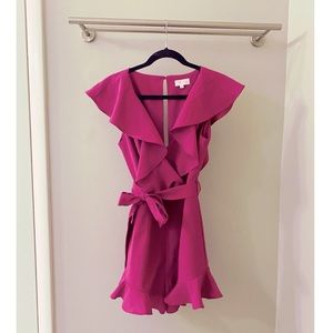 Pink Lily, medium, romper with ruffles and belt.